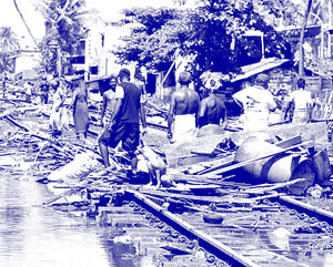 Residents sift through the trail of destruction along the coastal railway line in the southern Sri Lankan town of Lunawa after tsunami lashed more than half of Sri Lankas coastline.(www.abc.net.au)